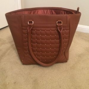 Brown with gold stud purse.