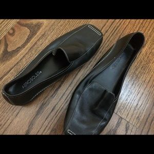 Classic black loafers with white stitching
