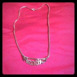 Pre-owed sterling silver name tag necklace .