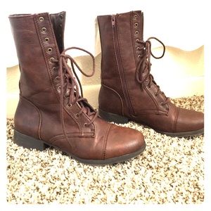 Brown laced up combat boots