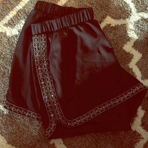 Black embellished dolphin shorts