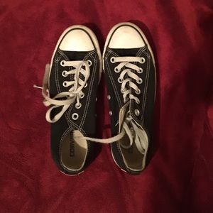 Worn black low converse