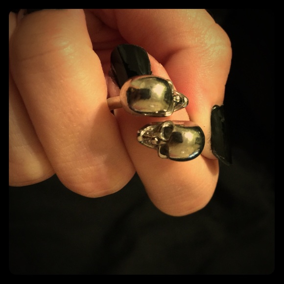 Alexander McQueen twin skulls ring.