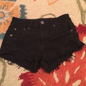black mid rise stretch shorts.