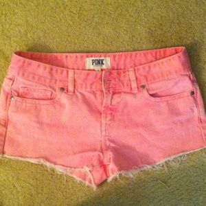 Faded pink denim shorts