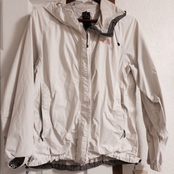 White Northface rain jacket with light pink decal
