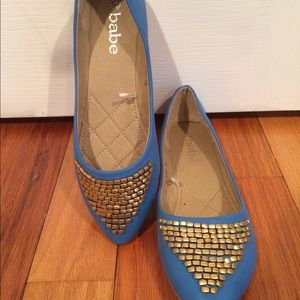 Blue ballet flats with details