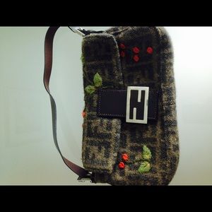 Cashmere brown Fendi purse with flower detail.