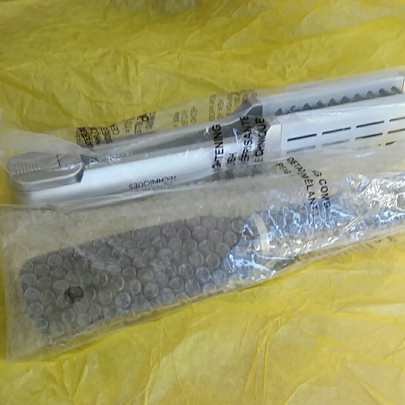 Detaching comb and  brush. New in bag.