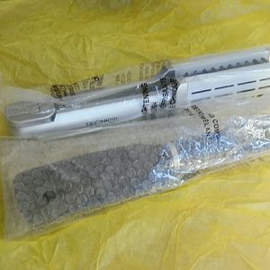 Detaching comb and  brush. New in bag.