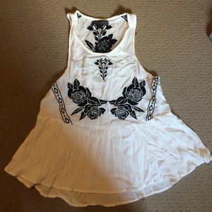 White sheet tank with black flower stitching