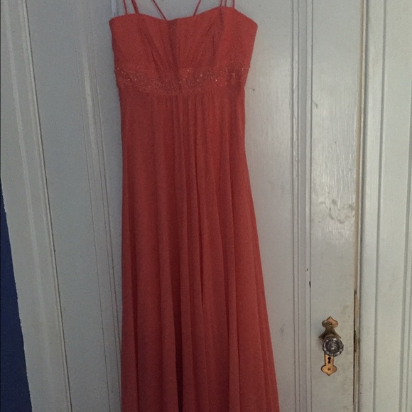 Floor length Salmon coloured prom dress.