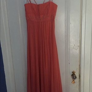Floor length Salmon coloured prom dress.