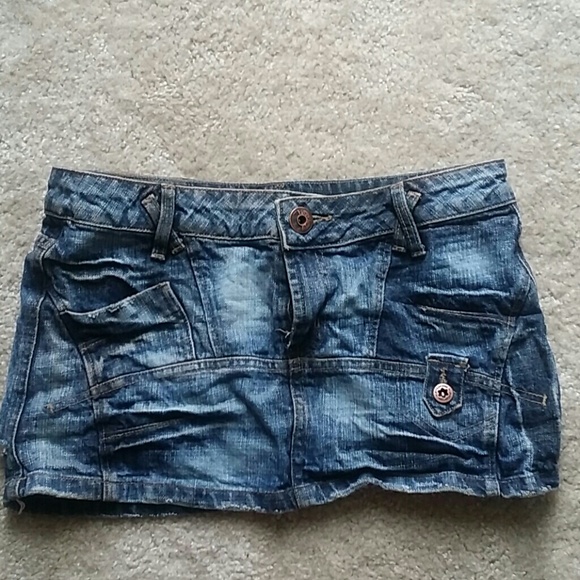 Denim destressed mini skirt. never worn (no tags)