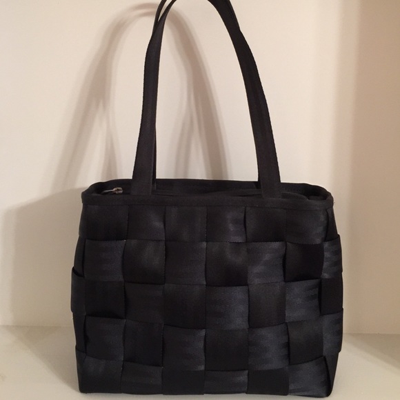 Black seatbelt style purse.
