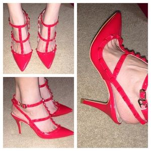 Red studded patent heels inspired by famous brand