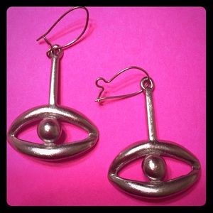 Very unique silver toned earring