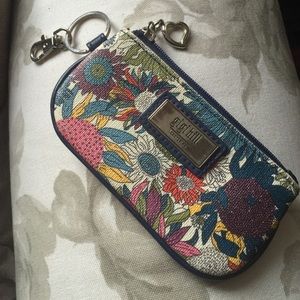 Gigi Hill coin, driver license and key holder