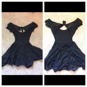 Black lacy romper with pockets and open back