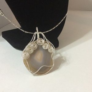 Tan. W/ grey swirls agate slice pendant