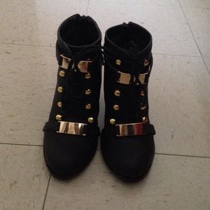 Michael Antonio Gold buckle lace up bootie.