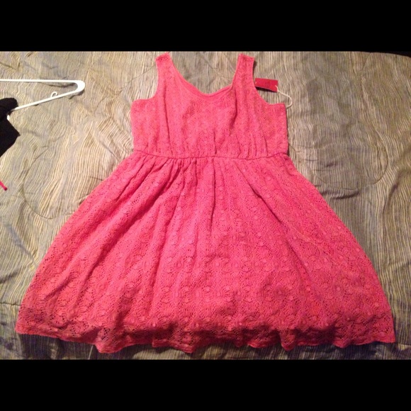 Coral/orange sleeveless summer dress.