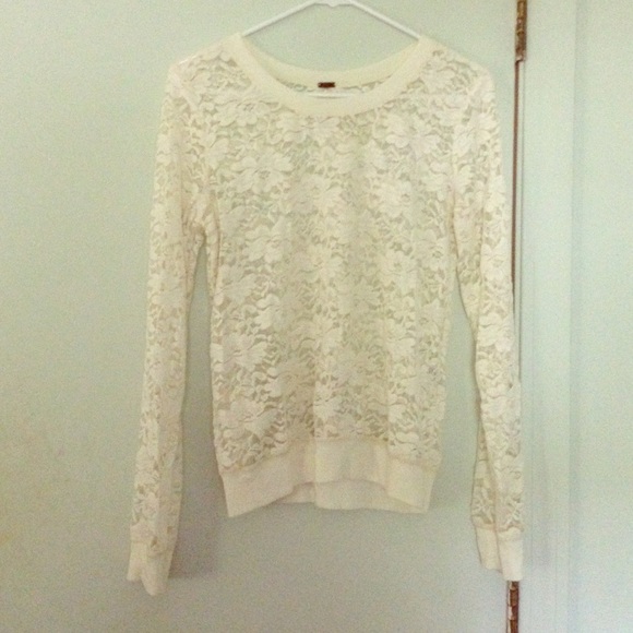 Long sleeved cream lace pullover top.