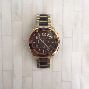 Michael Kors gold and tortoise watch.