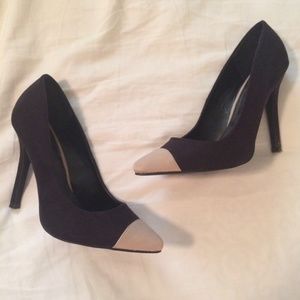 Black cap toe pumps