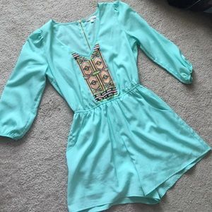 GB teal romper with Aztec pattern