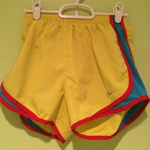 Neon colored Nike running shorts.