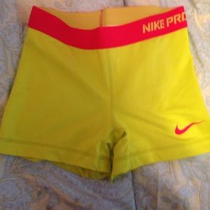 Neon yellow and pink Nike Pro spandex shorts