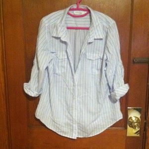 Woman light blue, white stripped button up.