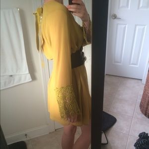 Green bell sleeved dress