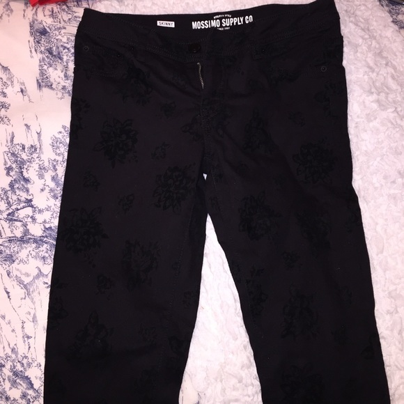 Velvet rose designs on black skinny jeans