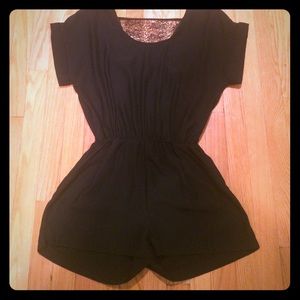 Black romper with lace panel in back