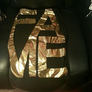 Black cotton tight skirt..FAME in gold metallic