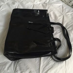 Black patent leather purse/brief case.
