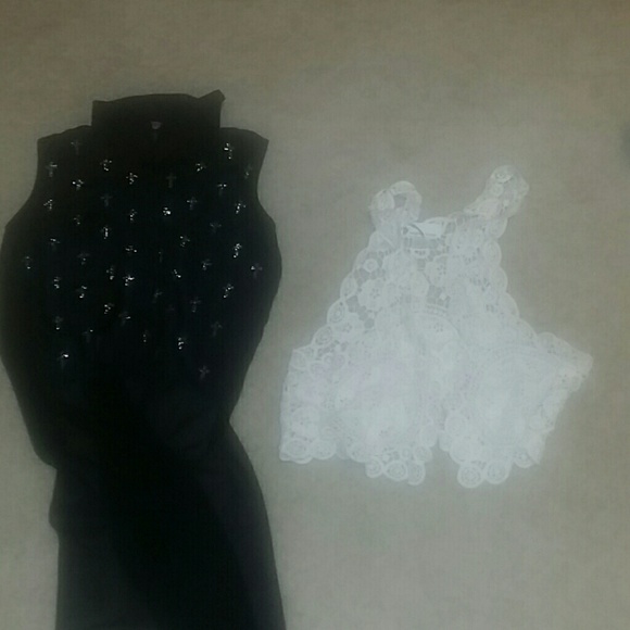 Black tank that is high and low. Cream vest