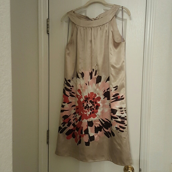 A champagne colored dress with a lining