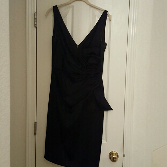 A black satin cocktail dress gathered in the waist