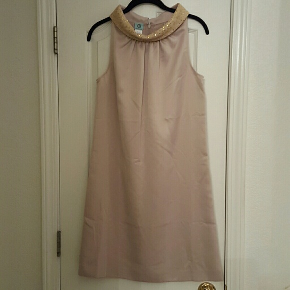 A champagne colored shift dress