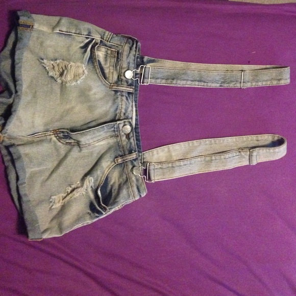 Distressed denim overalls