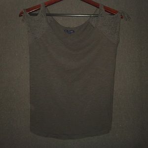 Grey top, lace sleeves.