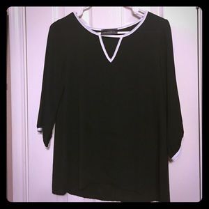 Lila Clothing Co. black top with white trim.
