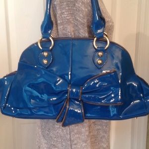 Blue patent leather hand bag.