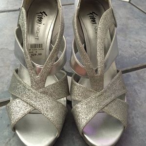 Silver open toe heels.
