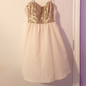 Cream figure skater style dress with gold sequins