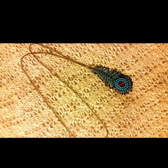 Teal Boho beaded feather necklace w/ red gem