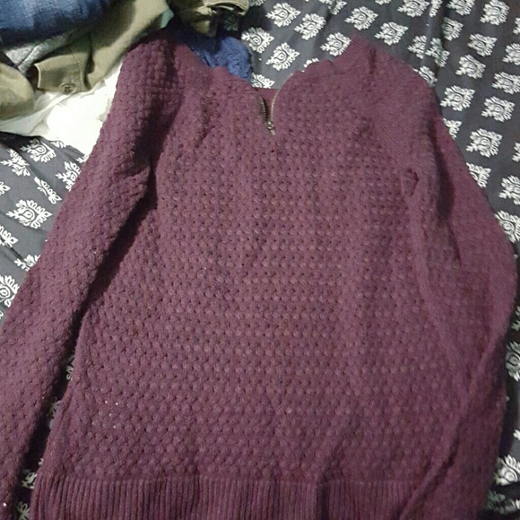A maroon sweater